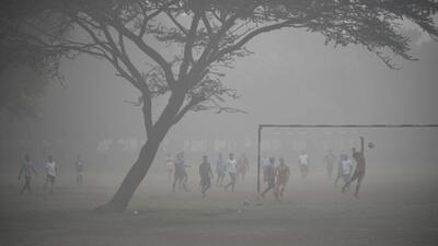 Gurugram, India-December 04: Boys playing football amid cold and foggy weather at a ground at sector-29 near Leisure Valley Park, in Gurugram, India, on Sunday, 04 December 2022. (Photo by Parveen Kumar/Hindustan Times)