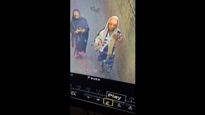 The incident was caught on the CCTV camera in which two unidentified women, who were wearing masks, could be seen carrying the newborn wrapped in a cloth and moving out of the hospital premises. (Video grab) The incident was caught on the CCTV camera in which two unidentified women, who were wearing masks, could be seen carrying the newborn wrapped in a cloth and moving out of the hospital premises. (Video grab)