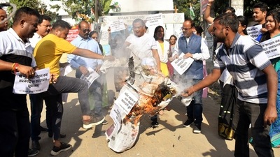 All India Trinamool Congress (AITC) supporters burn an effigy as they protest against All India United Democratic Front (AIDUF) chief and MP Badruddin Ajmal over his alleged remarks suggesting the Hindus to adopt the "Muslim formula" for marriage, at party office, in Guwahati on Saturday. (ANI Photo) All India Trinamool Congress (AITC) supporters burn an effigy as they protest against All India United Democratic Front (AIDUF) chief and MP Badruddin Ajmal over his alleged remarks suggesting the Hindus to adopt the "Muslim formula" for marriage, at party office, in Guwahati on Saturday. (ANI Photo)
