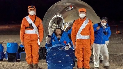 In this photo released by Xinhua News Agency, astronaut Chen Dong waves as he sits outside the re-entry capsule of the Shenzhou-14 manned space mission after it lands successfully at the Dongfeng landing site in northern China's Inner Mongolia Autonomous Region, Sunday. (AP) (AP) In this photo released by Xinhua News Agency, astronaut Chen Dong waves as he sits outside the re-entry capsule of the Shenzhou-14 manned space mission after it lands successfully at the Dongfeng landing site in northern China's Inner Mongolia Autonomous Region, Sunday. (AP) (AP)