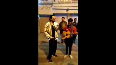 The image, taken from the Instagram video, shows Ayushmann Khurrana singing with a busker at Delhi’s Janpath. (Instagram/@guitar_boy_shivam) The image, taken from the Instagram video, shows Ayushmann Khurrana singing with a busker at Delhi’s Janpath. (Instagram/@guitar_boy_shivam)