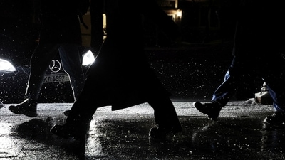 Russia-Ukraine War: People walk down along darkened streets during power outages while snow falls  in Kyiv, Ukraine, (Reuters)