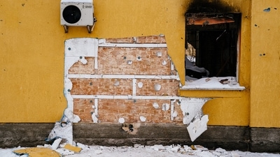 This photograph taken on December 3 shows a cut off of the wall of a damaged building from where a group people tried to steal a work of the famous British artist Banksy in the town of Gostomel, near Kyiv, amid the Russian invasion of Ukraine. (AFP)
