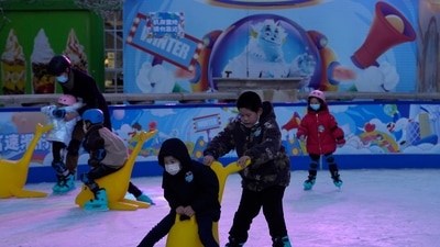 Children play at a mall with shops re-opening for business as restrictions are eased in Beijing. Chinese authorities announced a further easing of Covid-19 curbs with major cities such as Shenzhen and Beijing no longer requiring negative tests to take public transport. (AP Photo/Ng Han Guan)