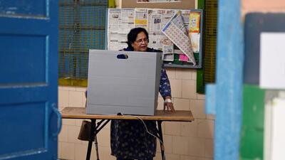 A woman casts her vote at a polling booth in a school at Defence Colony during elections to the Municipal Corporation of Delhi (MCD) , on Sunday. (Vipin Kumar/HT Photo) A woman casts her vote at a polling booth in a school at Defence Colony during elections to the Municipal Corporation of Delhi (MCD) , on Sunday. (Vipin Kumar/HT Photo)