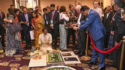 G20 Sherpa of India, Amitabh Kant with the delegates witness a display of Jal Sanjhia, at the 1st G20 Sherpas Meet, in Udaipur on Sunday. Jal Sanjhi is a centuries-old temple art form where water becomes the artist’s canvas usually made to honour Lord Krishna during the festival of Navratri. (ANI Photo) (Ishant) G20 Sherpa of India, Amitabh Kant with the delegates witness a display of Jal Sanjhia, at the 1st G20 Sherpas Meet, in Udaipur on Sunday. Jal Sanjhi is a centuries-old temple art form where water becomes the artist’s canvas usually made to honour Lord Krishna during the festival of Navratri. (ANI Photo) (Ishant)