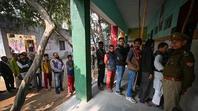 Voters wait in a queue to cast their vote at a polling booth in a government school at Zakir Nagar for the MCD elections on Sunday. (Sanchit Khanna/HT Photo) Voters wait in a queue to cast their vote at a polling booth in a government school at Zakir Nagar for the MCD elections on Sunday. (Sanchit Khanna/HT Photo)