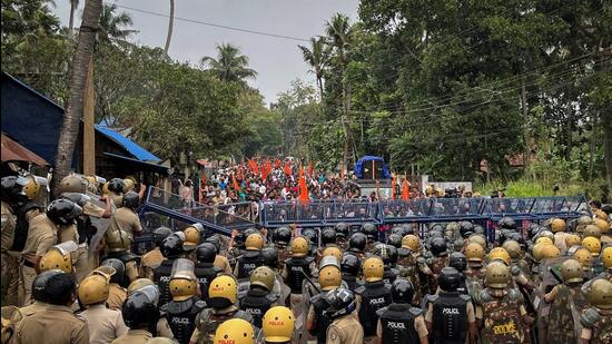 Police officers stand guard near the barricades during a protest rally by the supporters of the proposed Vizhinjam port project in the southern state of Kerala. (REUTERS) Police officers stand guard near the barricades during a protest rally by the supporters of the proposed Vizhinjam port project in the southern state of Kerala. (REUTERS)