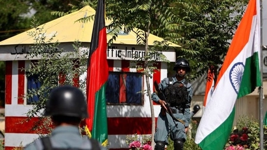 Afghan policemen stand guard next to Indian and Afghan national flags, at a check point in Kabul, Afghanistan.(Reuters/File) Afghan policemen stand guard next to Indian and Afghan national flags, at a check point in Kabul, Afghanistan.(Reuters/File)