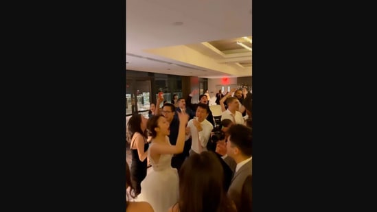 The image, taken from the Instagram video, shows the bride at her wedding party where a DJ played a song by Taylor Swift.(Instagram/@djmikelujan)