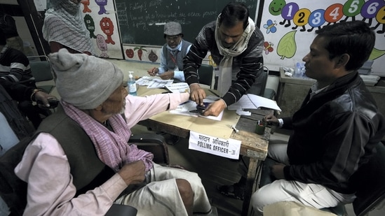 New Delhi: A wheelchair bound voter before casting his vote for the Municipal Corporation of Delhi (MCD) elections, at a polling station in Majnu-ka-tilla area, Sunday.(PTI)