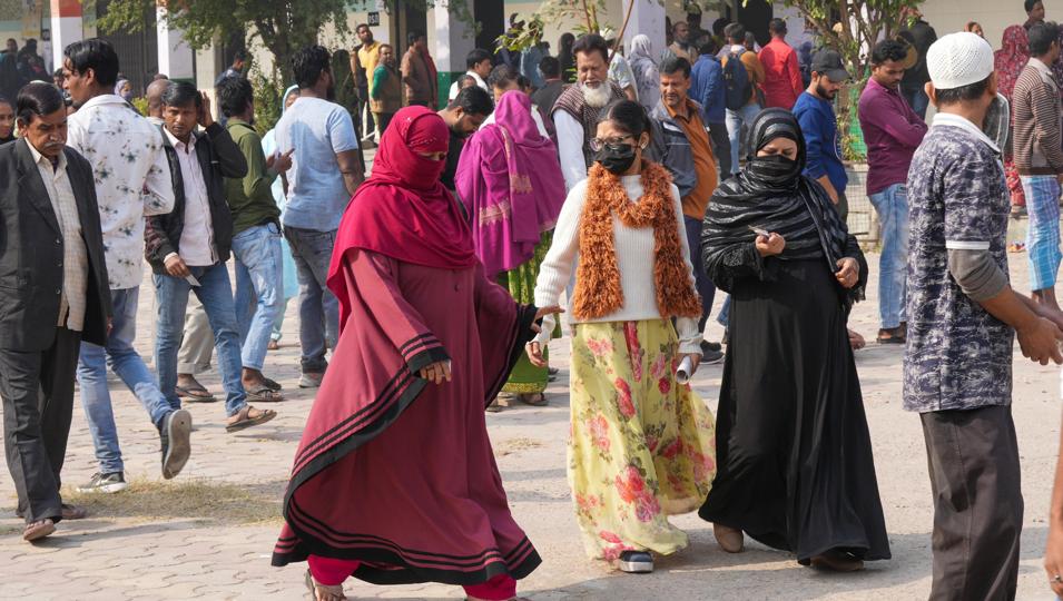 Voters after casting their votes for the Municipal Corporation of Delhi (MCD) elections, at a polling station in Jahangirpuri area, in New Delhi, on Sunday. Jahangirpuri had witnessed communal clashes. (PTI) Voters after casting their votes for the Municipal Corporation of Delhi (MCD) elections, at a polling station in Jahangirpuri area, in New Delhi, on Sunday. Jahangirpuri had witnessed communal clashes. (PTI)