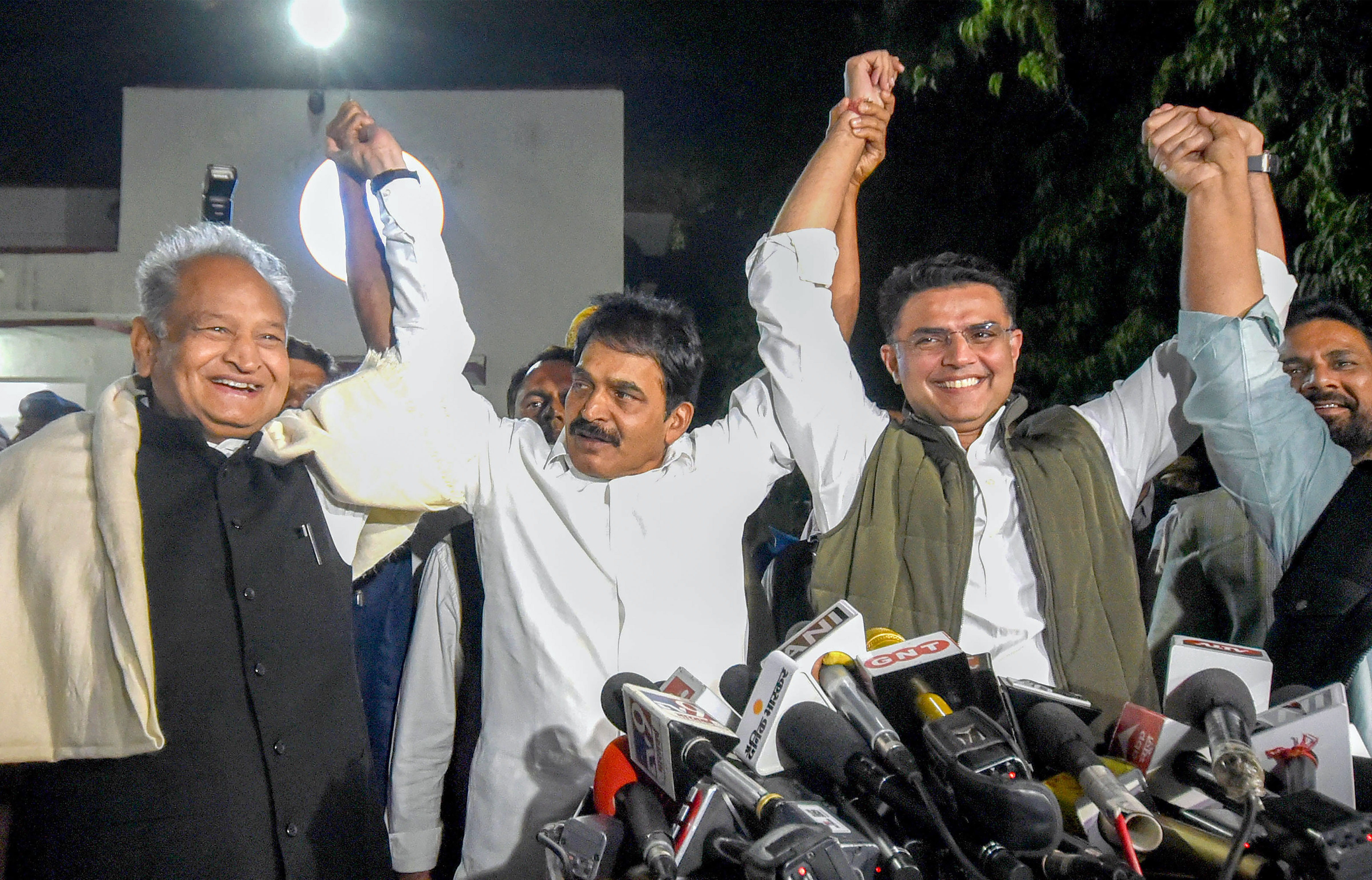 Congress general secretary KC Venugopal raises his hands with Rajasthan chief minister Ashok Gehlot, party leader Sachin Pilot and the party state President Govind Singh Dotasra during the state level coordination committee meeting on 'Bharat Jodo Yatra' at party headquarters, in Jaipur, Tuesday, November 29, 2022. (PTI Photo) Congress general secretary KC Venugopal raises his hands with Rajasthan chief minister Ashok Gehlot, party leader Sachin Pilot and the party state President Govind Singh Dotasra during the state level coordination committee meeting on 'Bharat Jodo Yatra' at party headquarters, in Jaipur, Tuesday, November 29, 2022. (PTI Photo)