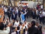 Prime Minister Narendra Modi waves to supporters on his way to the polling booth to cast his vote for the second phase of Gujarat assembly elections, in Ahmedabad on Monday. (ANI Photo) Prime Minister Narendra Modi waves to supporters on his way to the polling booth to cast his vote for the second phase of Gujarat assembly elections, in Ahmedabad on Monday. (ANI Photo)