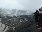 Indonesia's Semeru Volcano: Villagers watch hot smoke from the ground at the Curah Kobokan village following Mount Semeru's volcanic eruption.(AFP) Indonesia's Semeru Volcano: Villagers watch hot smoke from the ground at the Curah Kobokan village following Mount Semeru's volcanic eruption.(AFP)