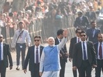 Prime Minister Narendra Modi waves to people as he arrives to cast his vote during the second phase of Gujarat state assembly elections in Ahmedabad, Monday.(AP) Prime Minister Narendra Modi waves to people as he arrives to cast his vote during the second phase of Gujarat state assembly elections in Ahmedabad, Monday.(AP)