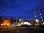 Duke Energy personnel work to restore power at a crippled electrical substation that the workers said was hit by gunfire after the Moore County Sheriff said that vandalism caused a mass power outage, in Carthage, North Carolina, U.S. December 4, 2022.