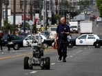 A police officer uses a robot to investigate a bomb threat in San Francisco in 2008.