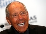 Tennis coach Nick Bollettieri laughs during a news conference where he was introduced as one of the five new inductees to the International Tennis Hall of Fame in New York