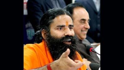 Baba Ramdev addresses a press conference on black money as Janta Party leader Subramanian Swamy looks on at Constitution Club in New Delhi. HT Photo/Virendra Singh Gosain Baba Ramdev addresses a press conference on black money as Janta Party leader Subramanian Swamy looks on at Constitution Club in New Delhi. HT Photo/Virendra Singh Gosain