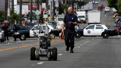 A police officer uses a robot to investigate a bomb threat in San Francisco in 2008. (AP file)