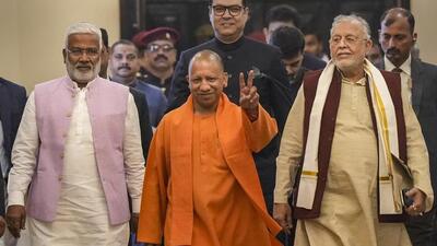 Uttar Pradesh chief minister Yogi Adityanath flanked by ministers Swatantra Dev Singh and Suresh Khanna on the first day of the winter session of the state assembly where the supplementary budget was presented. (PTI PHOTO) Uttar Pradesh chief minister Yogi Adityanath flanked by ministers Swatantra Dev Singh and Suresh Khanna on the first day of the winter session of the state assembly where the supplementary budget was presented. (PTI PHOTO)