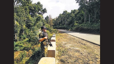 An Assam police officer at the spot of the firing (HT Photo)