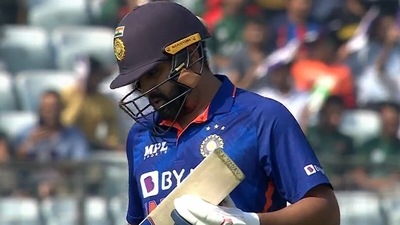 The brief moment when the 'SK Yadav' sign appeared on Rohit Sharma's bat (Screengrab) The brief moment when the 'SK Yadav' sign appeared on Rohit Sharma's bat (Screengrab)