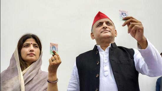 Samajwadi Party president Akhilesh Yadav and his wife and party candidate Dimple Yadav after casting their vote for the Mainpuri Lok Sabha bypolls, at Saifai in Etawah district on Monday. (PTI PHOTO)
