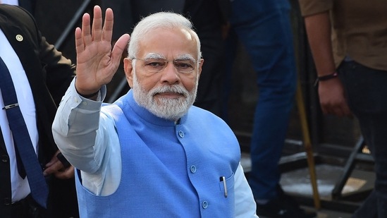 Prime Minister Narendra Modi gestures as he arrives to cast his vote for the second phase of the Gujarat state assembly election in Ahmedabad on Monday. (AFP)