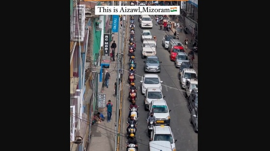 The image, taken from the viral video, shows cars and bikes moving in a disciplined way in  Mizoram’s Aizawl. (Instagram/@lizzwanders)
