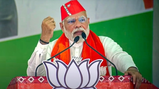 Prime Minister Narendra Modi addresses a BJP election rally in Gujarat's Anand district on Friday, Dec. 2, 2022. (PTI Photo)