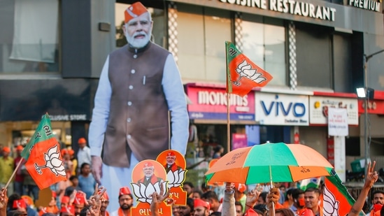 BJP supporters raise slogans during Prime Minister Narendra Modi's election campaign in Ahmedabad. (PTI Photo)