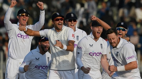 England's players celebrate after the dismissal of Pakistan's Salman Ali Agha (not pictured) during the fifth and final day of the first cricket Test match between Pakistan and England