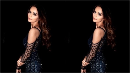 In classic black stilettos, Manushi wore her tresses open in wavy curls with a middle part as she posed for the cameras.(Instagram/@manushi_chhillar)