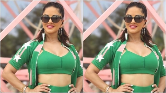 Sunny further layered her look in a green cropped jacket featuring details in pastel pink and white. In silver hoop earrings, tinted shades and a pair of white sneakers, Sunny aced the look.(Instagram/@sunnyleone)