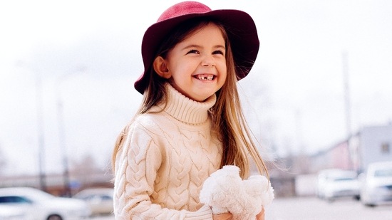 Introduce many stylish-looking sweaters to girls' wardrobe. (Pexels)