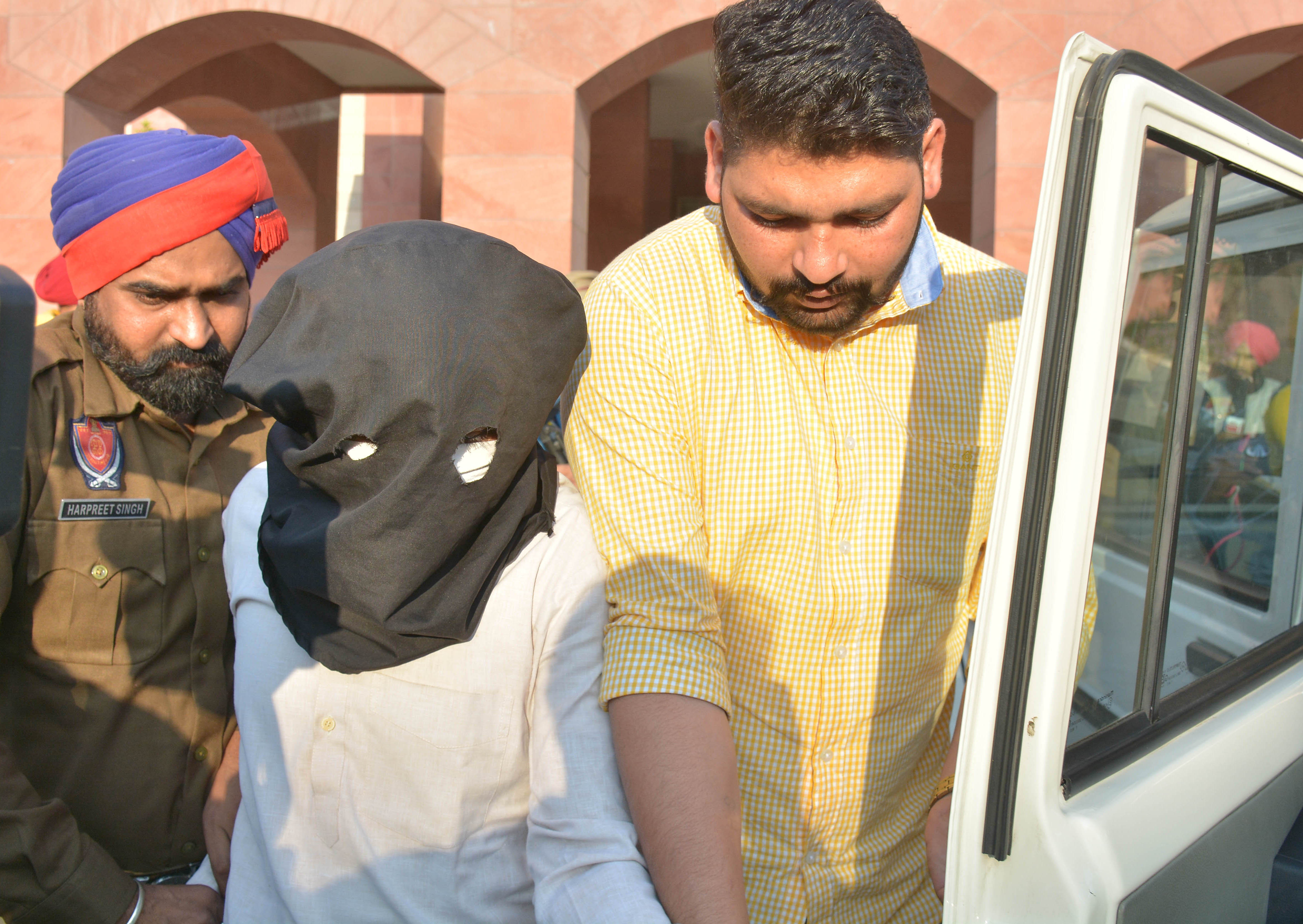 The accused, Ravi Kumar, in the custody of Mohali police on Monday. (Keshav Singh/HT) The accused, Ravi Kumar, in the custody of Mohali police on Monday. (Keshav Singh/HT)