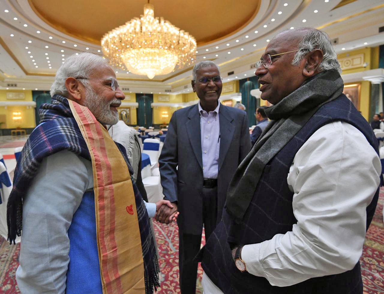 Prime Minister Narendra Modi interacts with Congress president Mallikarjun Kharge during an All-Party Meeting on G20 Summit, in New Delhi on Monday. CPI national general secretary, D. Raja also seen. (ANI Photo)