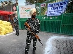 Security personnel guard the complex containing EVMs in a school at Gole Market in New Delhi on Monday. (Sanchit Khanna/HT Photo) Security personnel guard the complex containing EVMs in a school at Gole Market in New Delhi on Monday. (Sanchit Khanna/HT Photo)