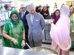 Britain's King Charles III meets volunteers who operate the 24-hour kitchen that feeds members of the local community during his visit to the newly built Guru Nanak Gurdwara, in Luton, north of London on December 6. Britain's King Charles III meets volunteers who operate the 24-hour kitchen that feeds members of the local community during his visit to the newly built Guru Nanak Gurdwara, in Luton, north of London on December 6.