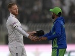 England's Ben Stokes, left, shakes hand with his Pakistani counterpart Babar Azam after winning the first test cricket match against Pakistan, in Rawalpindi, Pakistan, Monday, Dec. 5, 2022. (AP Photo/Anjum Naveed)(AP) England's Ben Stokes, left, shakes hand with his Pakistani counterpart Babar Azam after winning the first test cricket match against Pakistan, in Rawalpindi, Pakistan, Monday, Dec. 5, 2022. (AP Photo/Anjum Naveed)(AP)