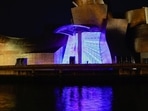 Spain Digital Nomad Visa: The atrium of the Guggenheim Museum is illuminated in Bilbao, Spain.