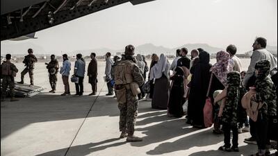 Evacuees wait to board a Boeing C-17 Globemaster III during an evacuation at Hamid Karzai International Airport in Kabul, Afghanistan on August 30, 2021. (via REUTERS) Evacuees wait to board a Boeing C-17 Globemaster III during an evacuation at Hamid Karzai International Airport in Kabul, Afghanistan on August 30, 2021. (via REUTERS)