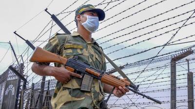 A Border Security Force (BSF) soldier stands guard near the Indo-Pak border. (PTI File Photo) A Border Security Force (BSF) soldier stands guard near the Indo-Pak border. (PTI File Photo)