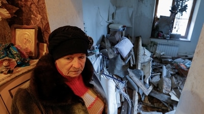 In the aftermath of the shelling, a 70-year-old local resident Lyudmila shows her apartment inside a house heavily damaged in recent shelling in Donetsk, on December 6. (Alexander Ermochenko / REUTERS ) In the aftermath of the shelling, a 70-year-old local resident Lyudmila shows her apartment inside a house heavily damaged in recent shelling in Donetsk, on December 6. (Alexander Ermochenko / REUTERS )