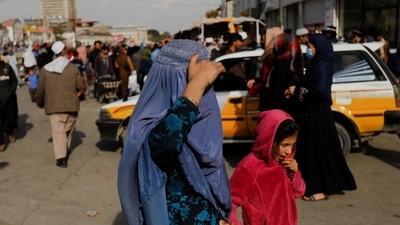 Afghanistan: An Afghan woman and a girl walk in a street in Kabul, Afghanistan. (Reuters)