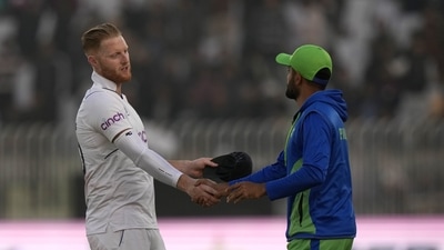 England's Ben Stokes, left, shakes hand with his Pakistani counterpart Babar Azam after winning the first test cricket match against Pakistan, in Rawalpindi, Pakistan, Monday, Dec. 5, 2022. (AP Photo/Anjum Naveed) (AP) England's Ben Stokes, left, shakes hand with his Pakistani counterpart Babar Azam after winning the first test cricket match against Pakistan, in Rawalpindi, Pakistan, Monday, Dec. 5, 2022. (AP Photo/Anjum Naveed) (AP)