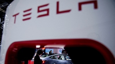 A Tesla electric vehicle is seen through a charging point. (REUTERS)