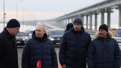 Vladimir Putin: Russian President Vladimir Putin visits a bridge connecting the Russian mainland with the Crimean Peninsula. (Reuters)